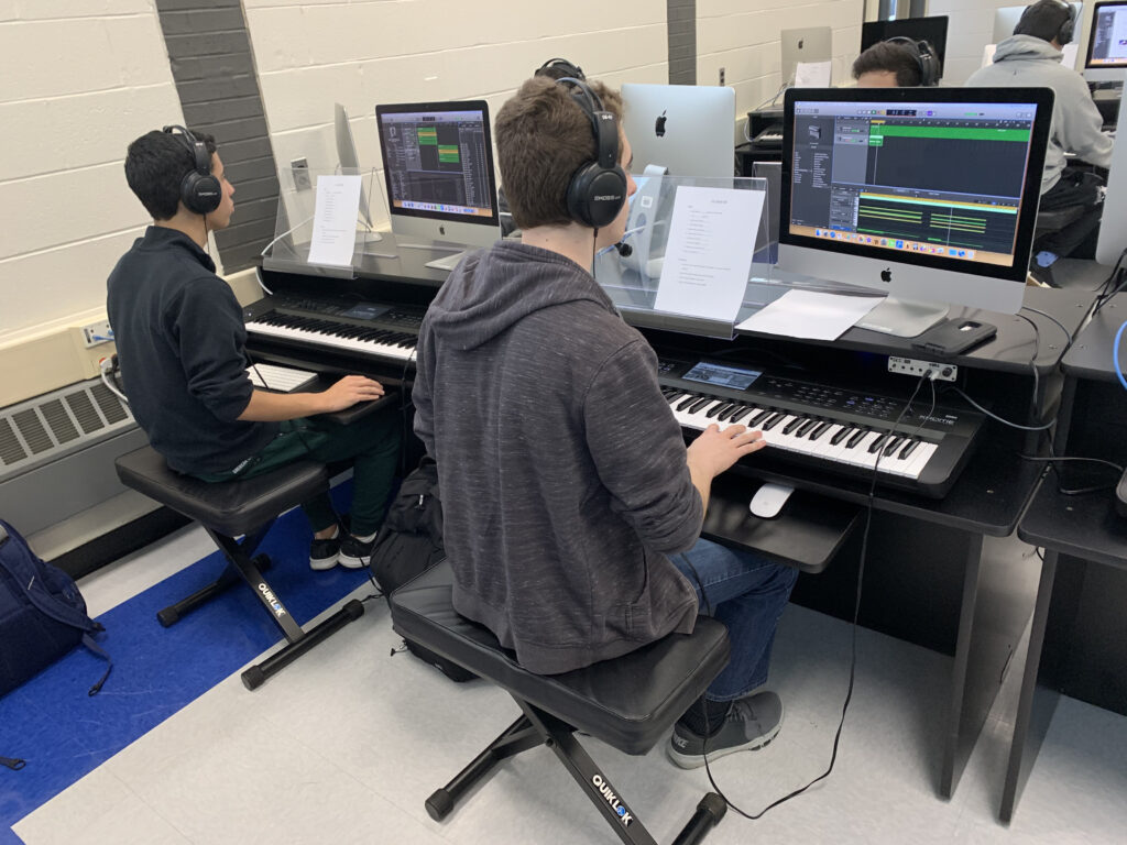 classroom combining digital tools and traditional instruments