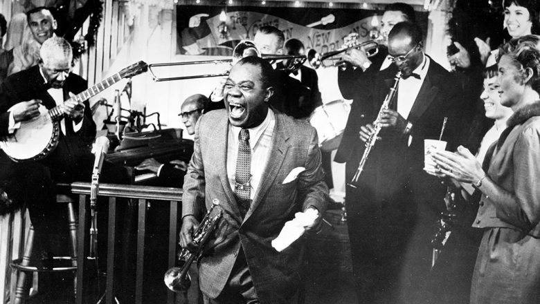 A black-and-white archival image of a jazz club or Armstrong performing